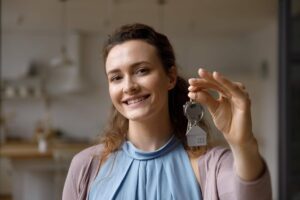 Sell house fast in Portland Oregon with happy homeowner receiving keys after quick sale