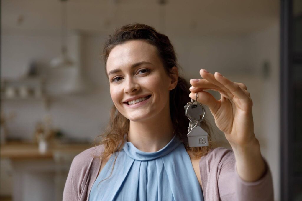 Sell house fast in Portland Oregon with happy homeowner receiving keys after quick sale