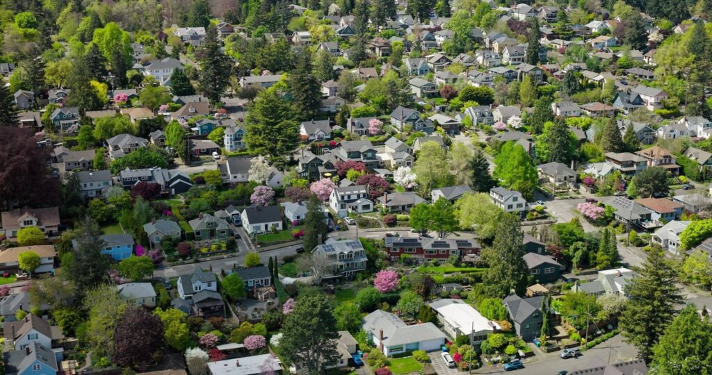 Portland real estate outlook showing residential housing market and modern homes in Portland Oregon skyline