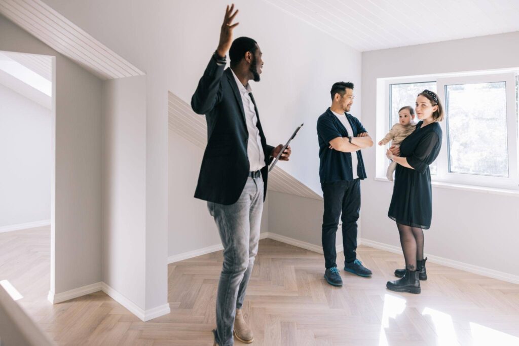 Buy home in Portland Oregon with happy family receiving house keys