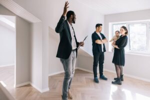 Buy home in Portland Oregon with happy family receiving house keys
